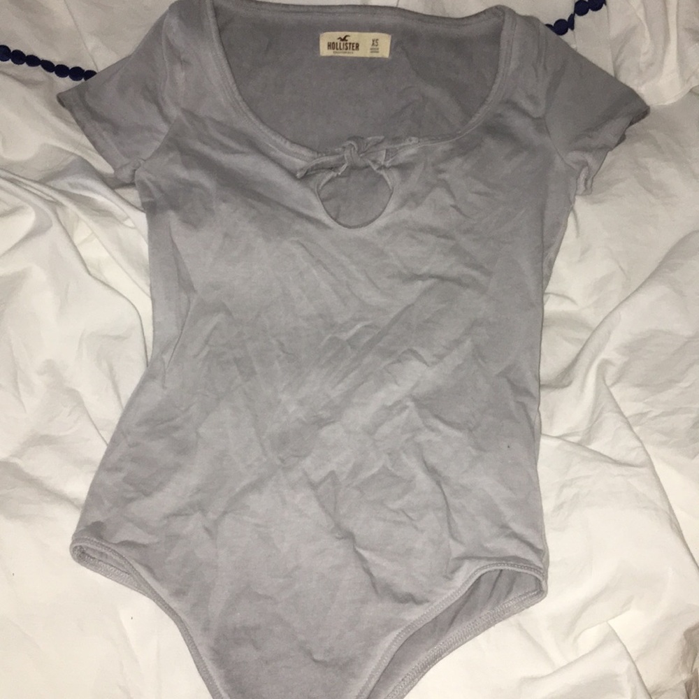 light grey bodysuit with a tie in front
